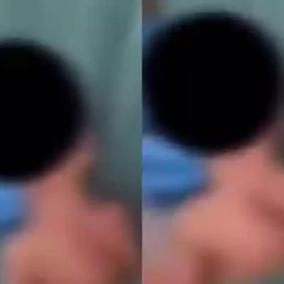 Quem é a fisioterapeuta dançando com recém-nascido no bolso do jaleco em maternidade